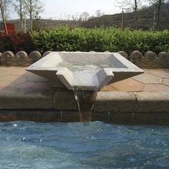 Stone Composite Scupper Site Amenity Draining into a swimming pool