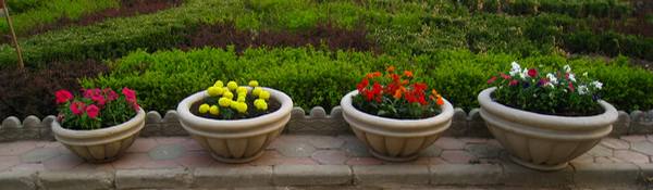 4 Different sizes and colors of our Stone Composite Roman Style Planters & Site Amenities